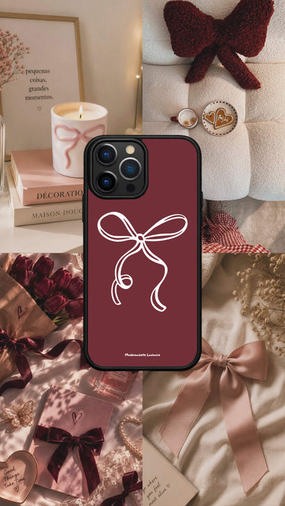 Coque de téléphone Darling bordeaux avec illustration minimaliste d'un nœud blanc