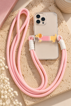Cordon rose Lana avec motif teckel présenté sur un téléphone
