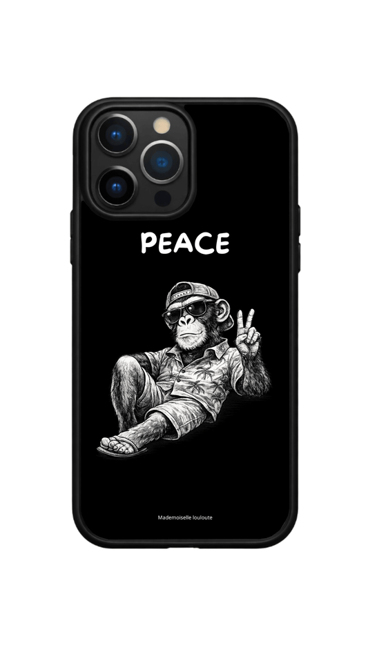 COQUE, INSCRIPTION PEACE, AVEC UN SINGE LUNETTE DE SOLEIL 